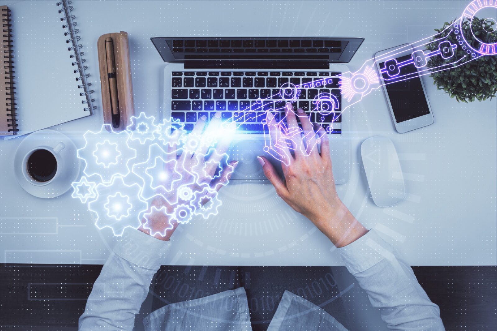 A data theme hologram drawing overlaid on a woman's hands working on a laptop.